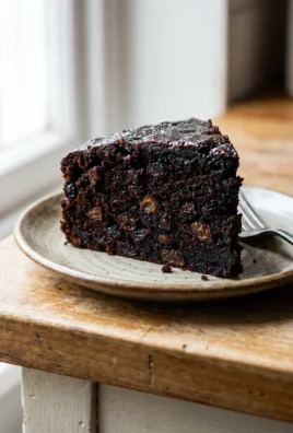 Close-up of the moist, dense crumb of a slice of Jamaican rum cake.